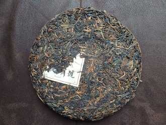 Pressed Raw Pu-erh Tea - Sheng pu-erh 2011 from 500-year-old trees of the Nanno Mountains of the Kaishunhao factory, 400 g, 