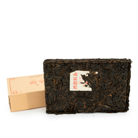 Pressed Rip Pu-erh Tea - Shu Pu'er 2022 "Pressed brick of Pu'er tea" of the "Sacred Flame" brand from the "Xiaguan" factory, 250 g, 
